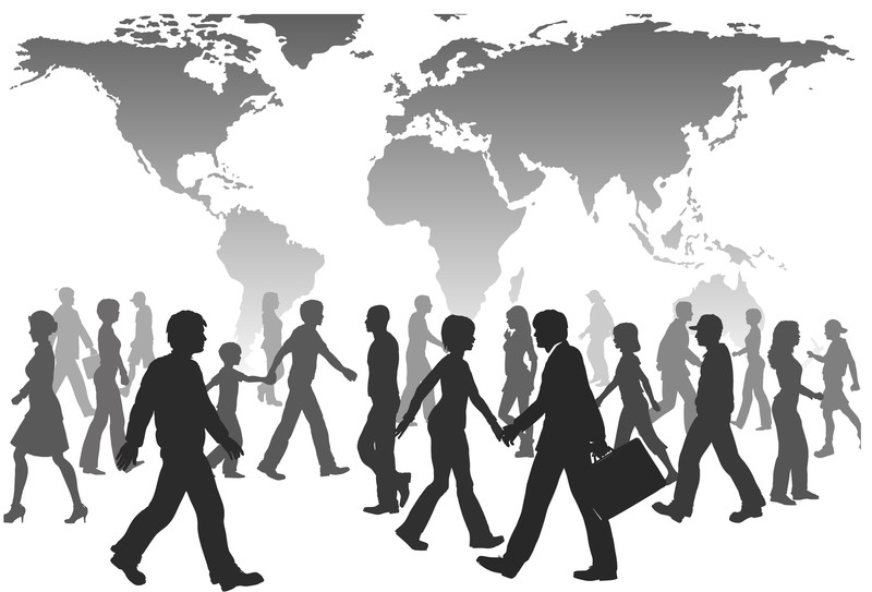 silhouette people walking infront of world map