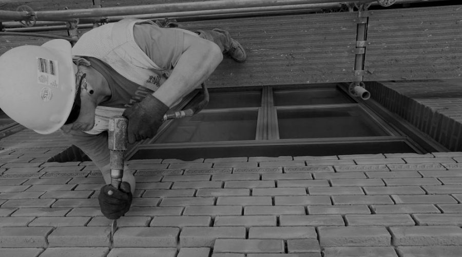 Builder drills wall