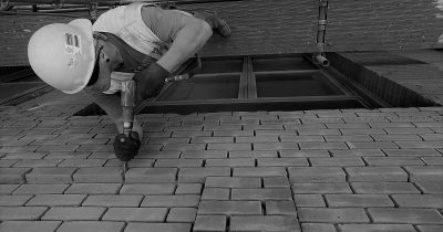over head shot of Builder drills between brick walls