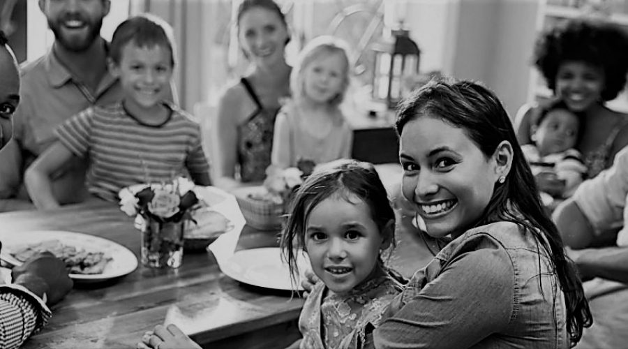 Multirace family at table